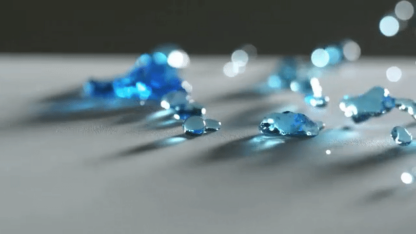 picture of water falling on paper treated with nano particles